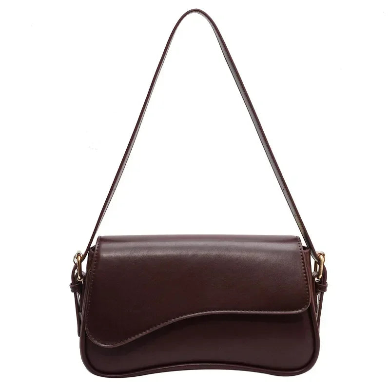 Bolso mujer de piel elegante y versátil con asa corta