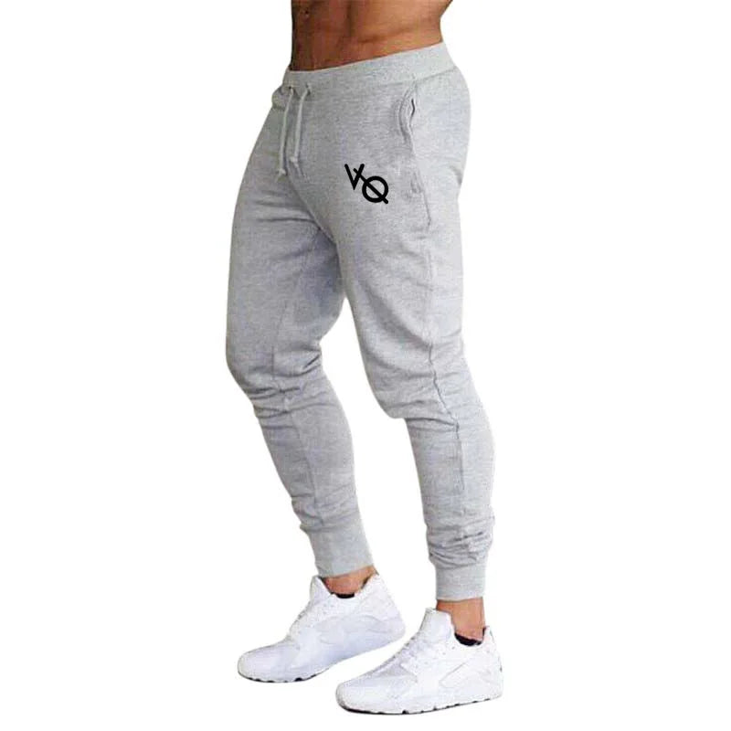 Pantalón deportivo hombre slim fit con puños en tobillos