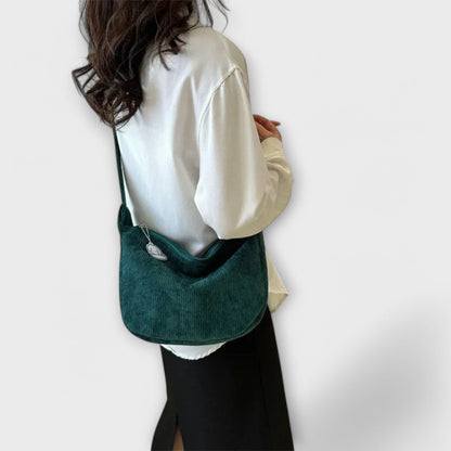 Bolso de hombro mujer con forma elegante acabado pulido