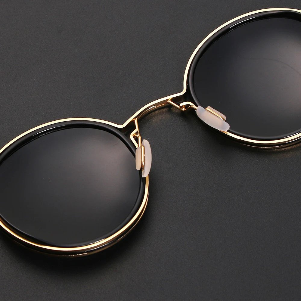 Gafas de sol unisex montura redonda polarizadas varillas metálicas