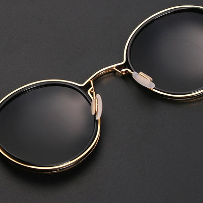 Gafas de sol unisex montura redonda polarizadas varillas metálicas